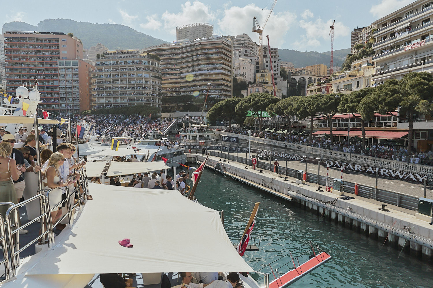View of the Nouvelle Chicane from a trackside yacht in Monaco Harbour